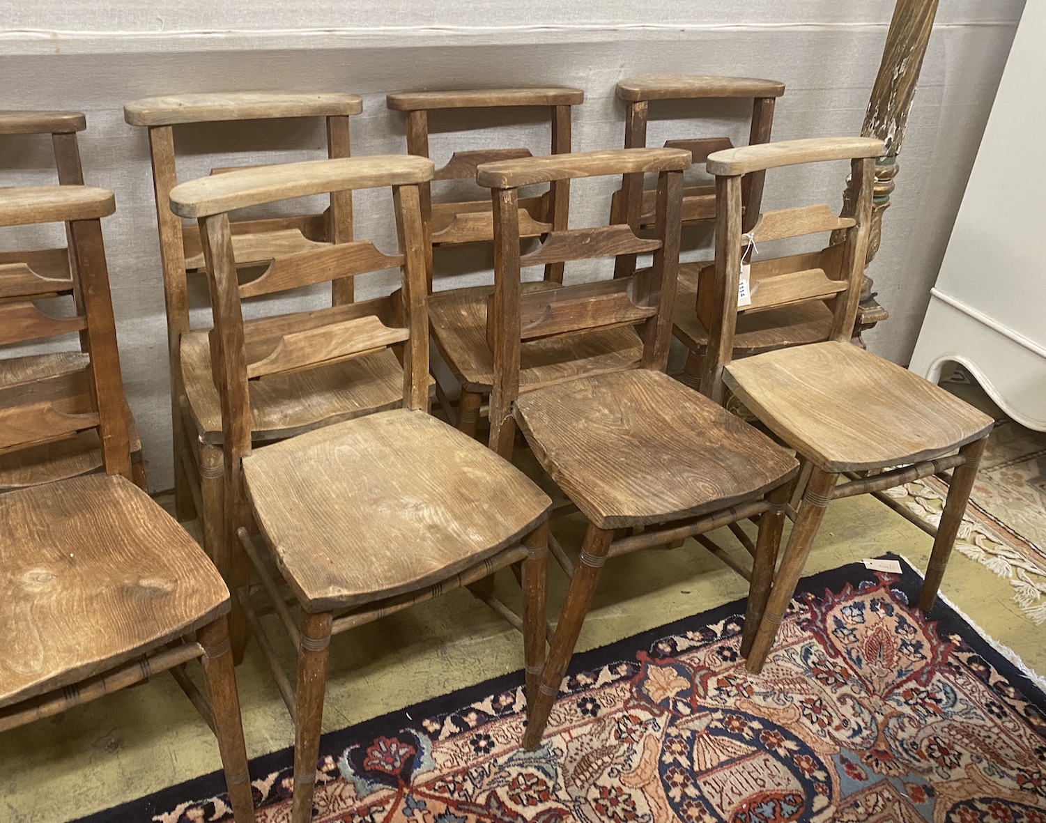 A set of ten elm and beech chapel chairs, width 37cm, depth 36cm, height 80cm
